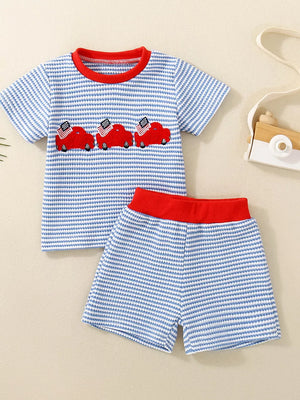 Baby boys' blue striped tee and shorts set with red car embroidery and red trim.