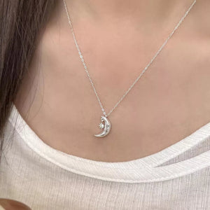 Sterling silver crescent moon and star charm necklace with adjustable chain