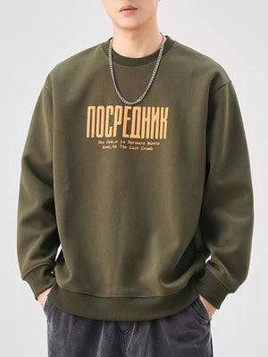 Oversized graphic sweatshirt in Army Green cotton blend with crewneck and text graphic.