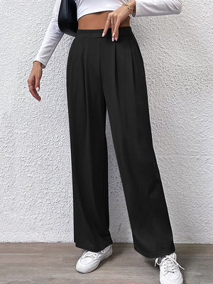 Black wide leg trousers with front pleats and a high waist.