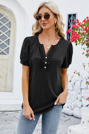 Black ruffled placket puff sleeve tee with a V-neckline and button detail.
