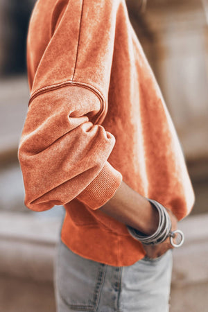 Acid wash sherbet sweatshirt with mock neck and ribbed cuffs.