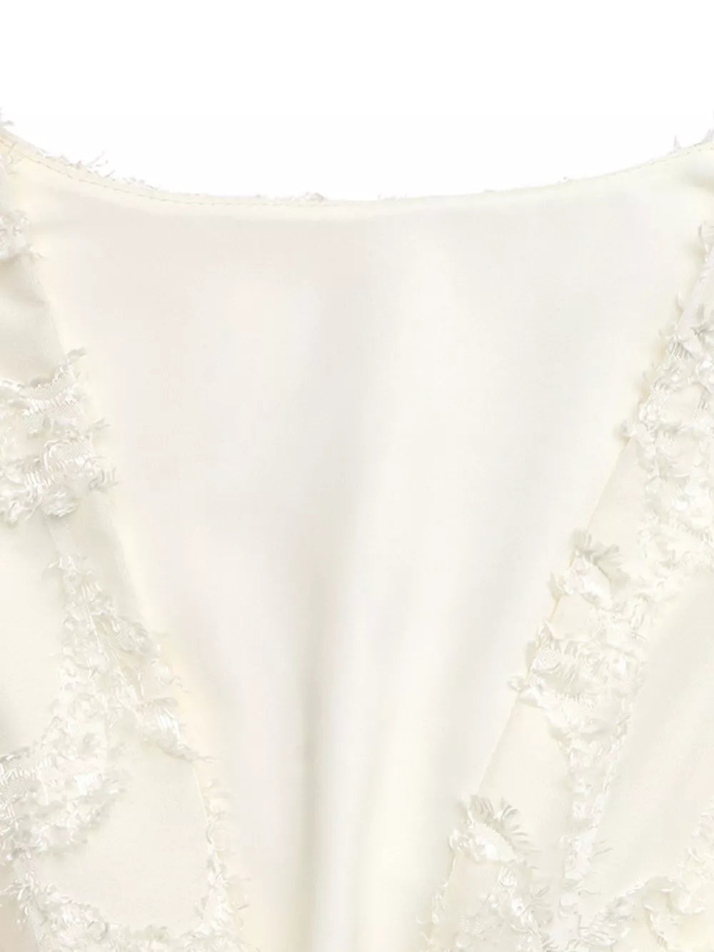 Chic textured mini dress in apricot with ruched detail and lace trim.