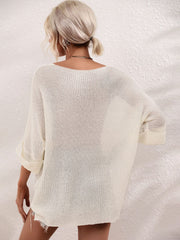 Ivory relaxed knit tunic top with boat neck and cuffed sleeves.