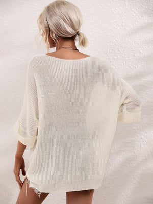 Ivory relaxed knit tunic top with boat neck and cuffed sleeves.
