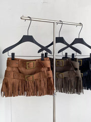 Tassel-trimmed belted mini skirt in brown with antique brass buckles and fringe detail.