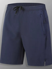 Dark blue men's athletic jogger shorts with drawstring and zip pockets.