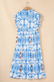 Blue and white botanical print tiered midi dress with ruffled flutter sleeves and mock neck.