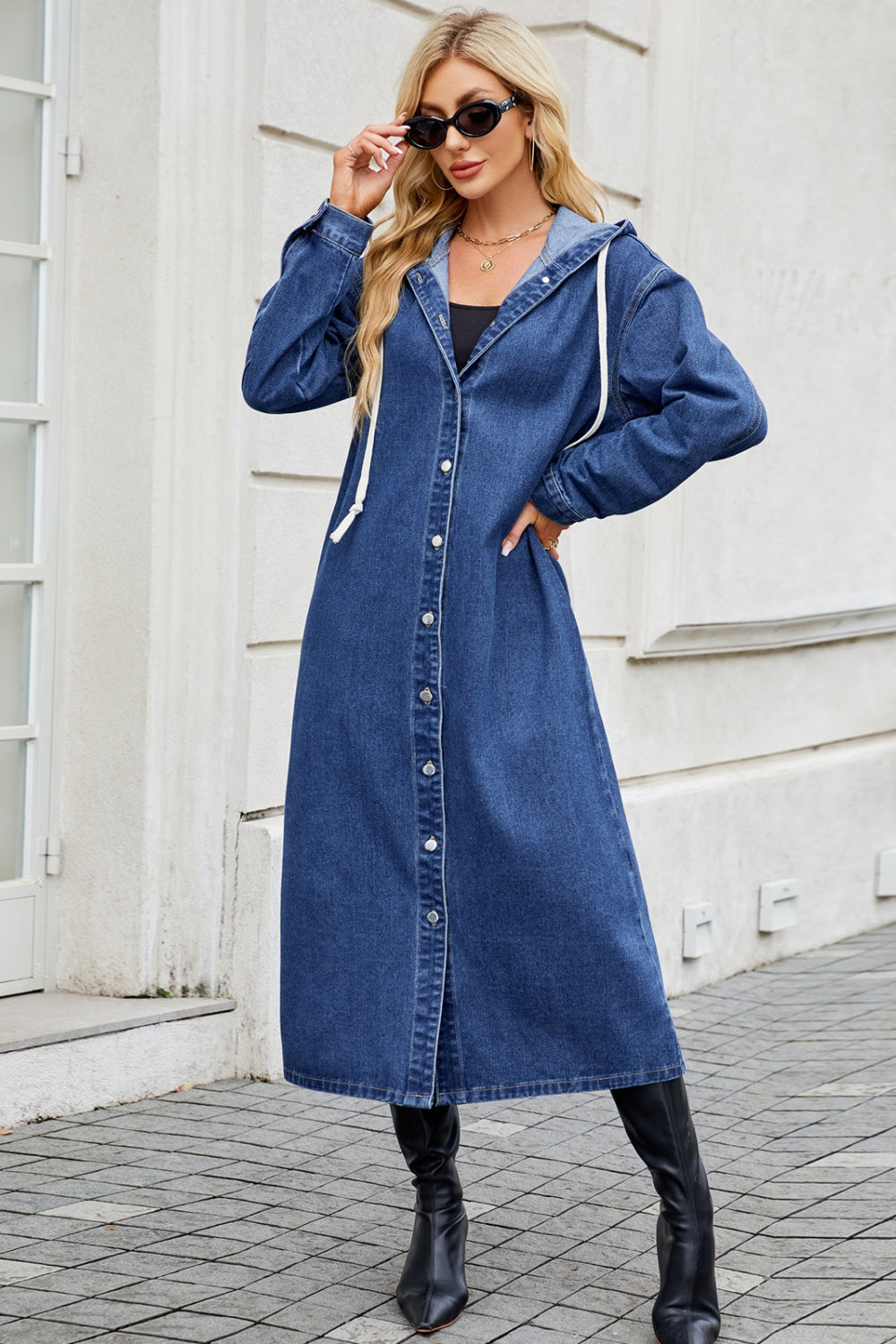 Denim maxi shirtdress in dark wash with hood and white drawstrings, button-down front.