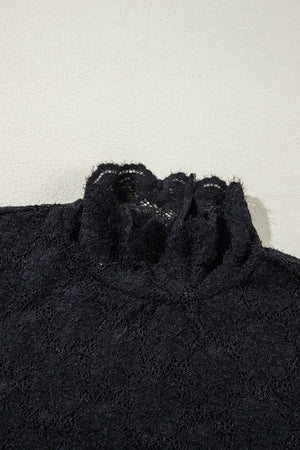 Black floral lace turtleneck blouse with ruffled neckline detail.