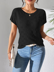 Black textured check knit pocket tee with crew neck and short sleeves.