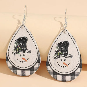 Festive snowman drop earrings with buffalo check pattern and black hat detail.