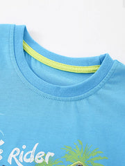 Blue cotton graphic tee with surf design and contrast neckline detail.