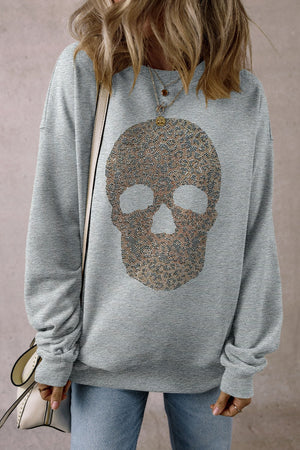 Gray cotton sweatshirt with an embellished skull motif on the front.