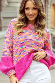 Colorblock marled knit sweater with balloon sleeves in hot pink and multicolor stripes.