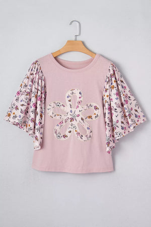 Maternity crew neck shirt in pink with floral patchwork sleeves and a large floral applique on the front.