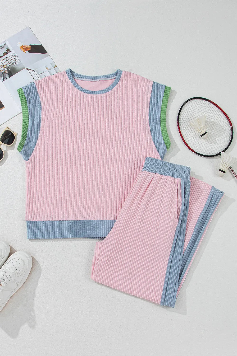 Ribbed blush pink loungewear set with blue and green trim. Sleeveless top and pants.