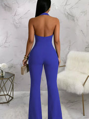 Blue halter cut-out jumpsuit with button detail and flared legs.