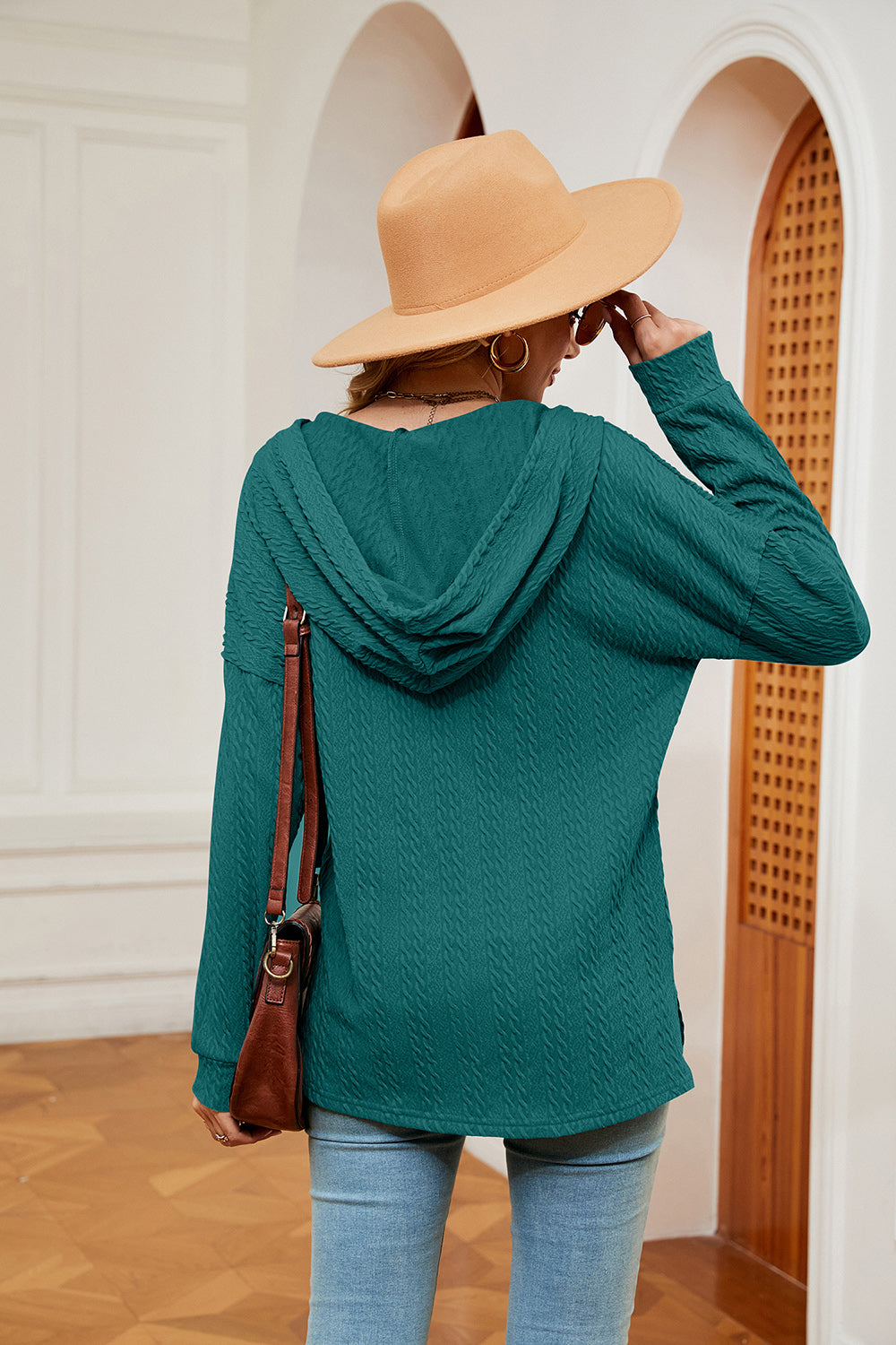 Teal textured henley hoodie with drop shoulder and hood.