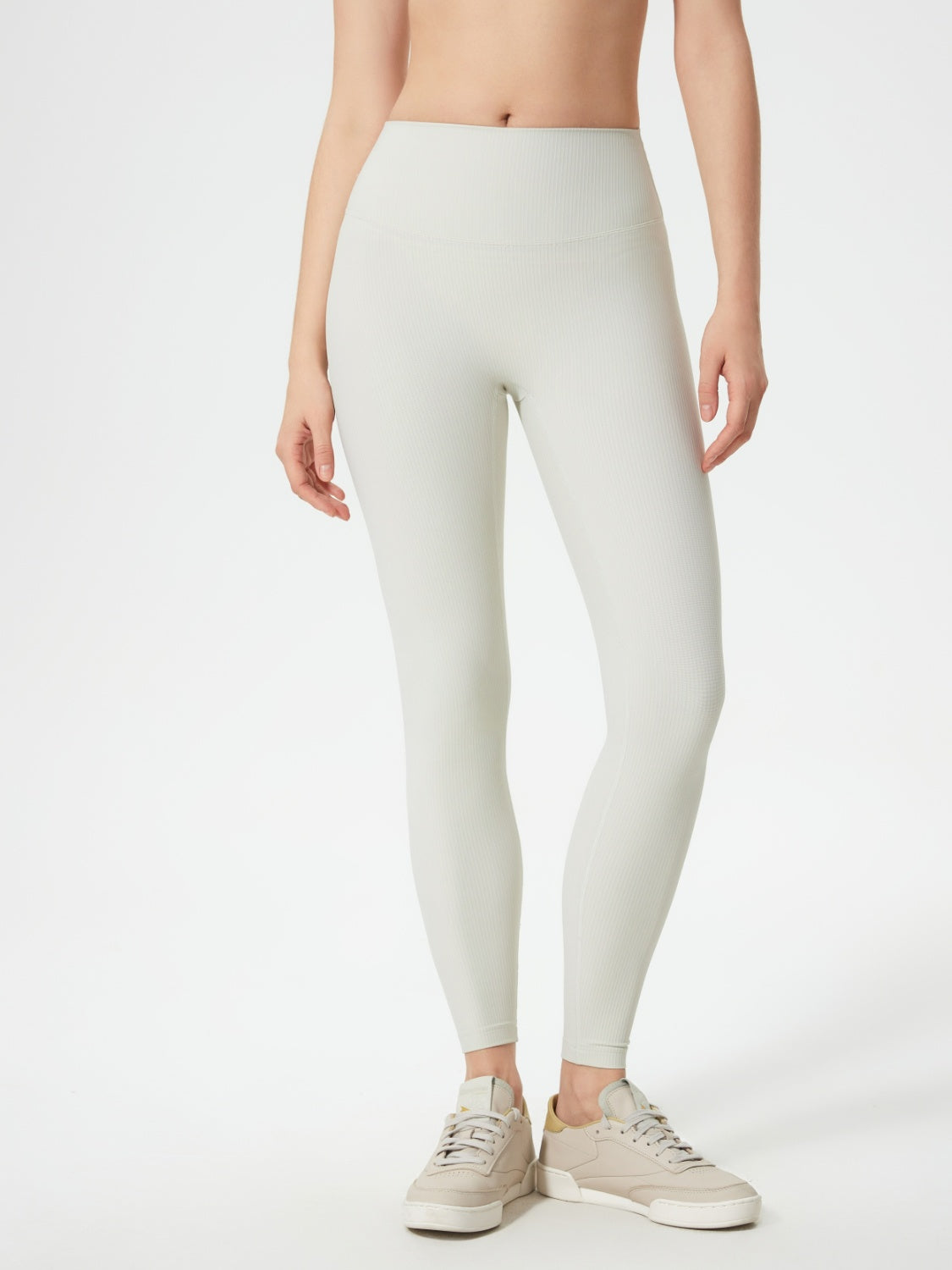 Light gray ribbed high-waist leggings with a seamless fit.