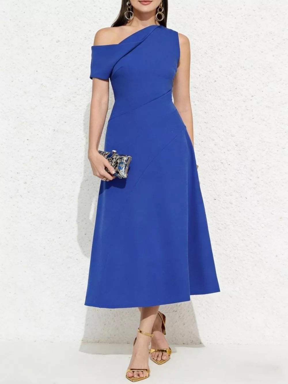 Blue asymmetrical midi dress with one-shoulder neckline and short sleeve.