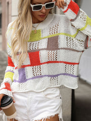 Patchwork openwork sweater with colorful blocks and open knit details.