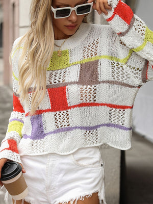 Patchwork openwork sweater with colorful blocks and open knit details.