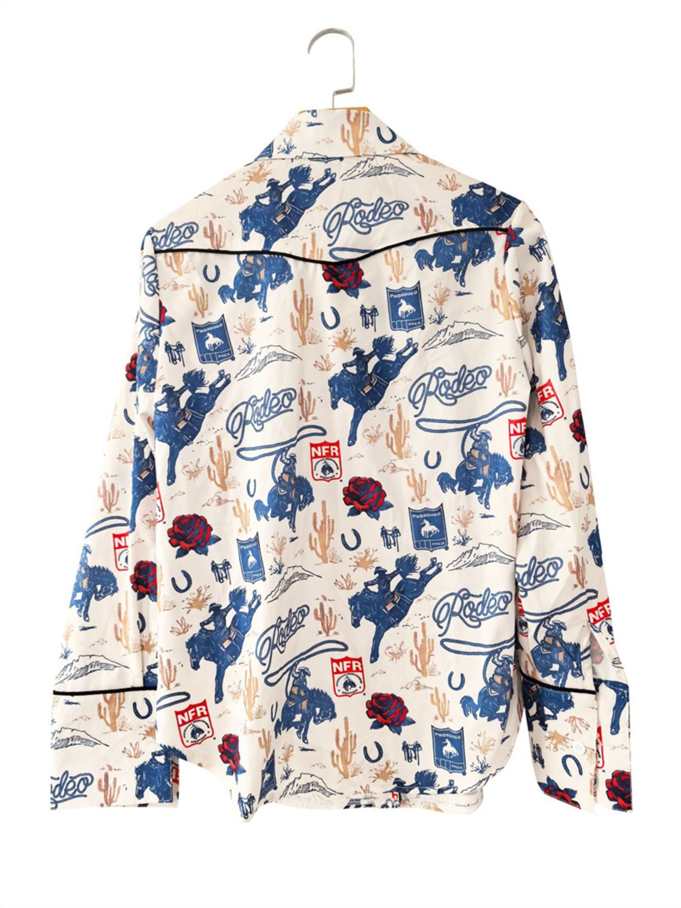 Maternity long sleeve button up shirt in Milky White with a rodeo print, cacti, horses, and roses.