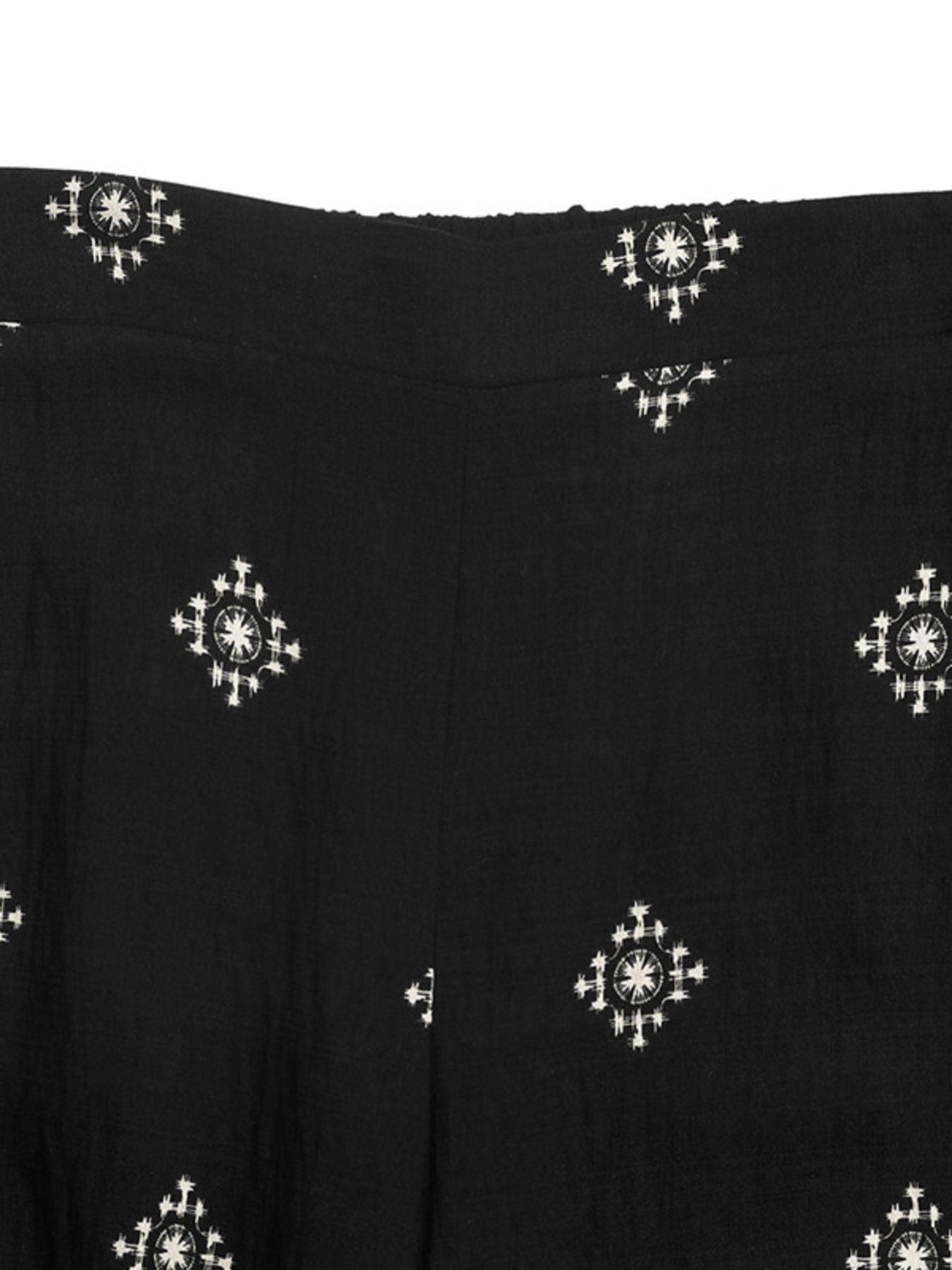 Black sleeveless top and pants set with white geometric print.