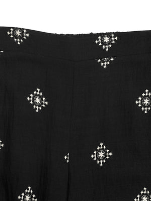 Black sleeveless top and pants set with white geometric print.