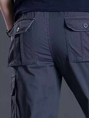 Men's dark gray relaxed fit cargo pants with multiple flap pockets.