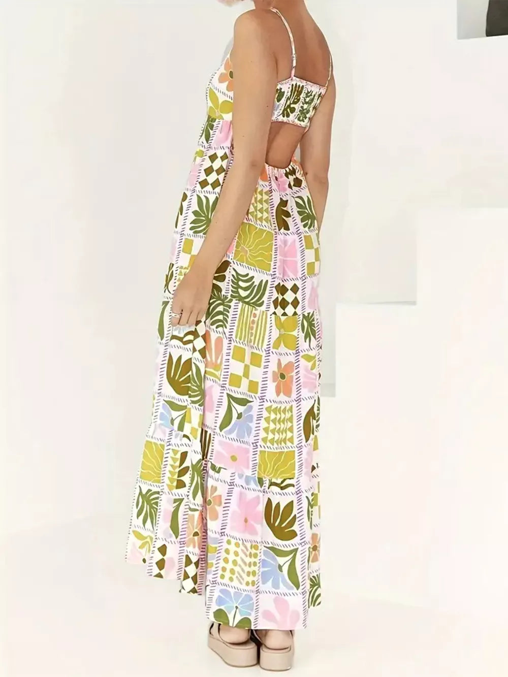 Maternity cami swim dress with cutout back and colorful patchwork floral print.