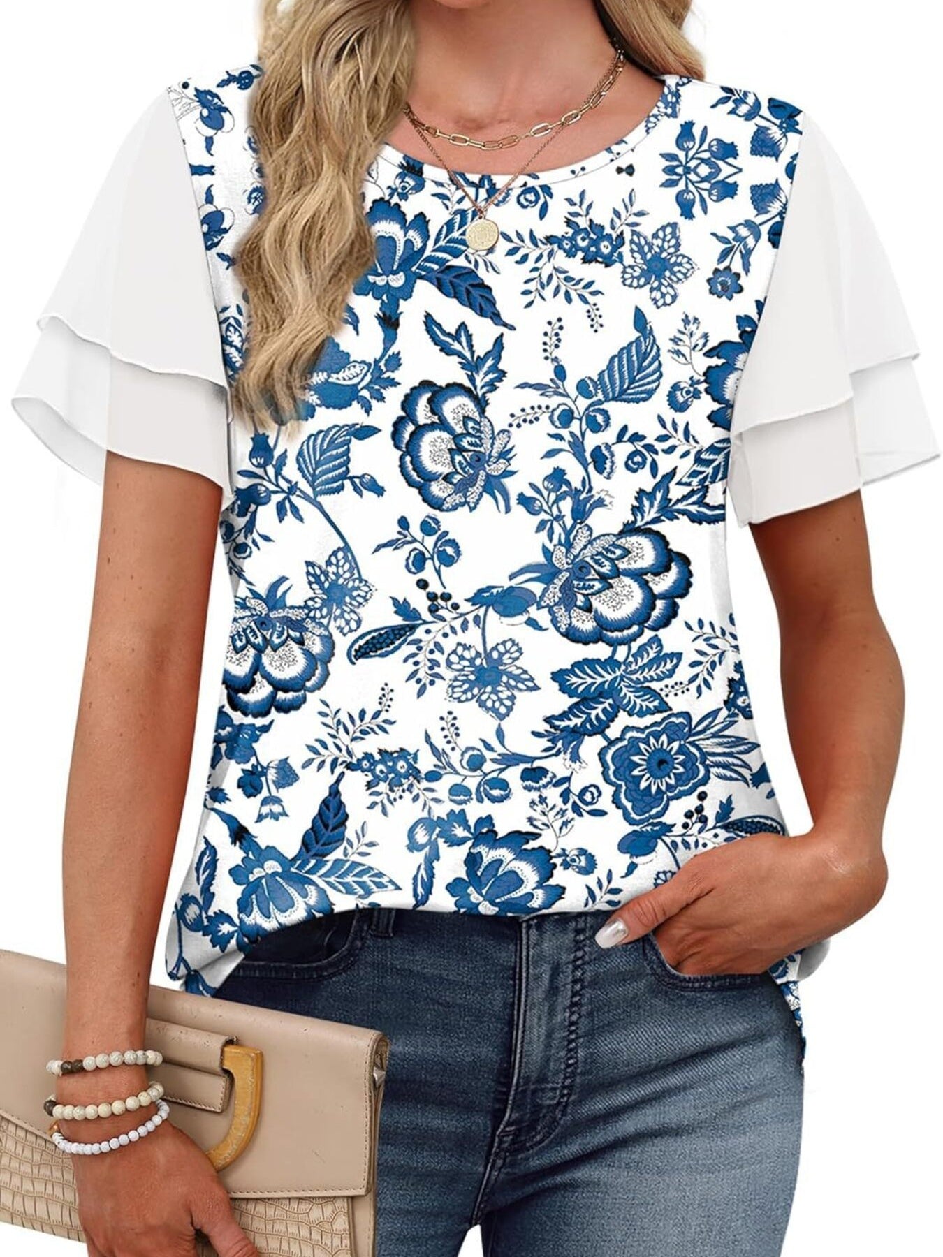 Blue floral print t-shirt with white layered ruffled short sleeves and a crew neck.