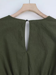 Olive green cotton romper with keyhole back detail and button closure