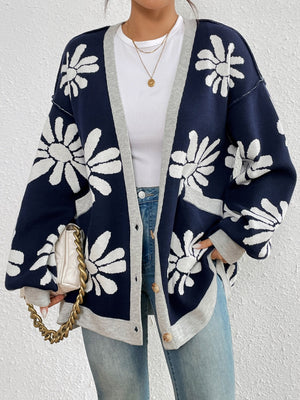 Dark navy floral jacquard knit cardigan with grey trim and buttons.