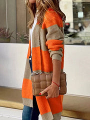 Color block knit cardigan with orange and beige stripes, open front, long sleeves.