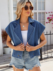 Denim double-breasted sleeveless jacket in dusty blue with a notched collar and button details.