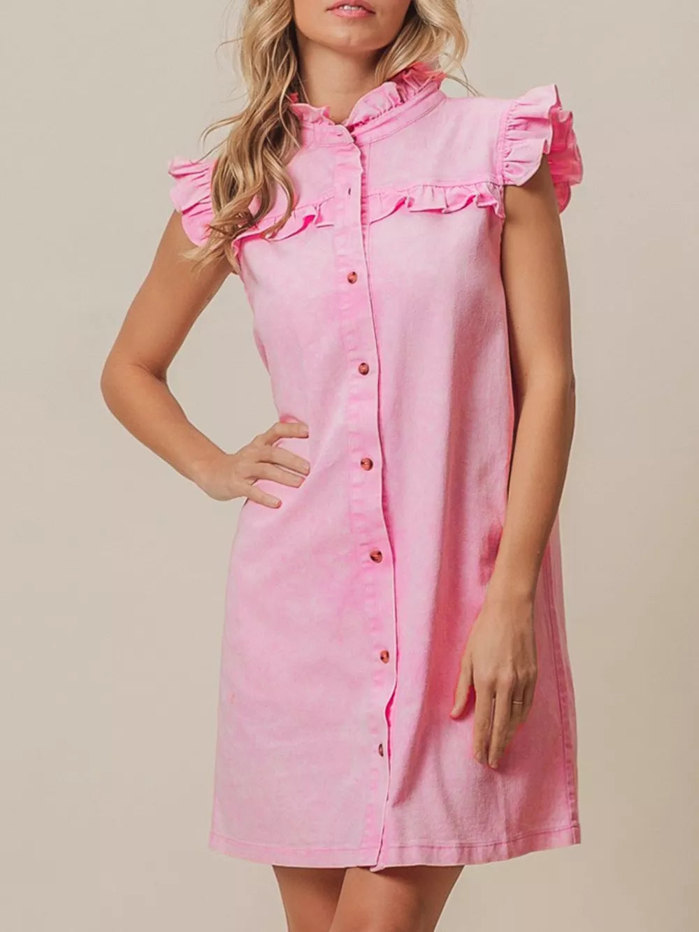 Pink denim dress with ruffled collar and cap sleeves, button-down front.