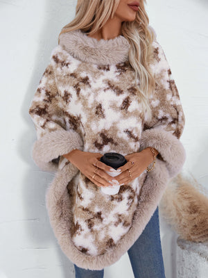 Faux fur trimmed camo poncho in Chocolate with a cozy, oversized fit and plush trim.