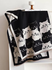 Charming reversible scarf with a black and white cat pattern, perfect for cat lovers.