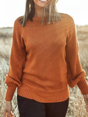 Caramel acrylic blend drop shoulder sweater with bow detail and ribbed cuffs.