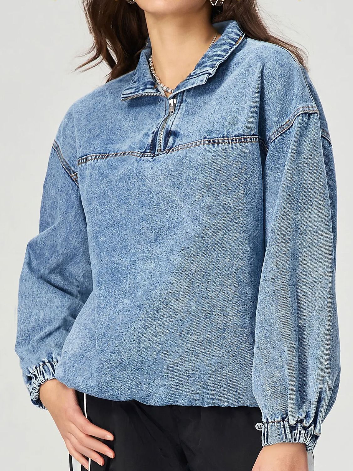 Acid wash denim pullover sweatshirt with quarter zip and elastic cuffs