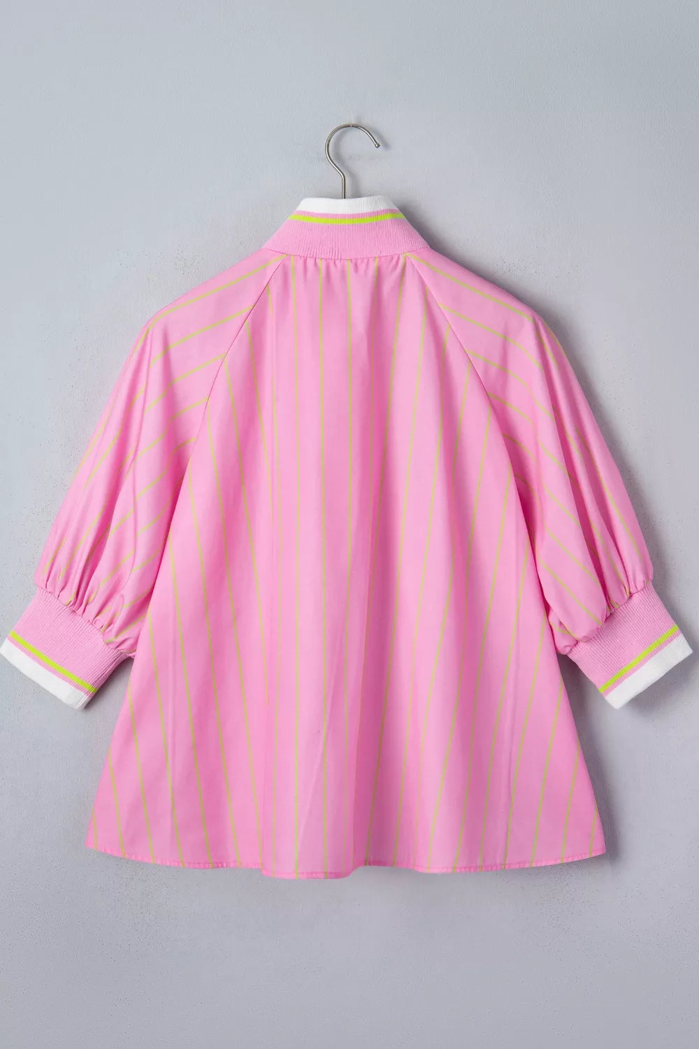 Pink striped casual shirt with white and lime green collar and cuffs.