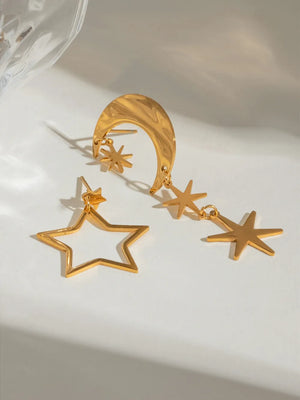 Gold celestial drop earrings with moon and star charms, 18K gold-plated.