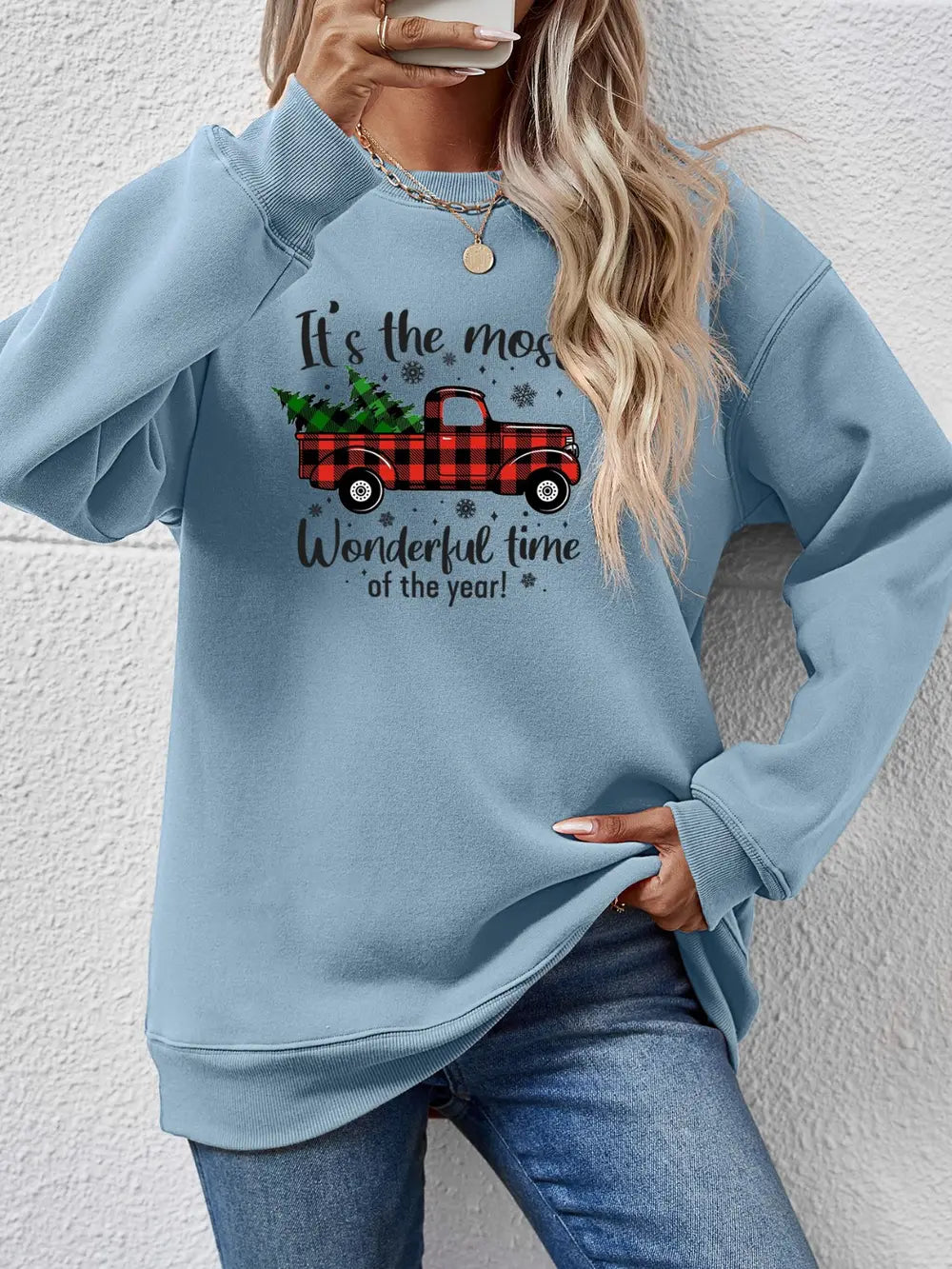 Misty Blue sweatshirt with a graphic print of a red plaid truck carrying Christmas trees and text.