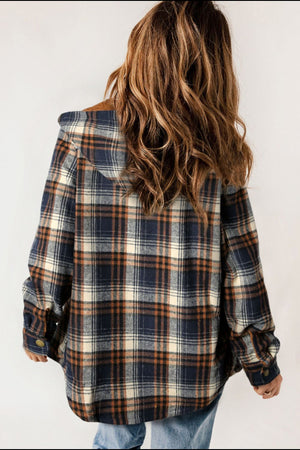 Sherpa-lined plaid overshirt jacket in blue, cream, and orange with button cuffs.