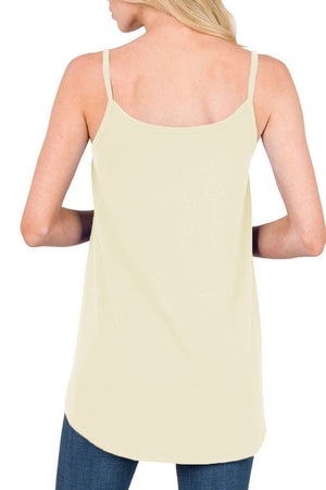 Ivory cami with spaghetti straps and curved hemline