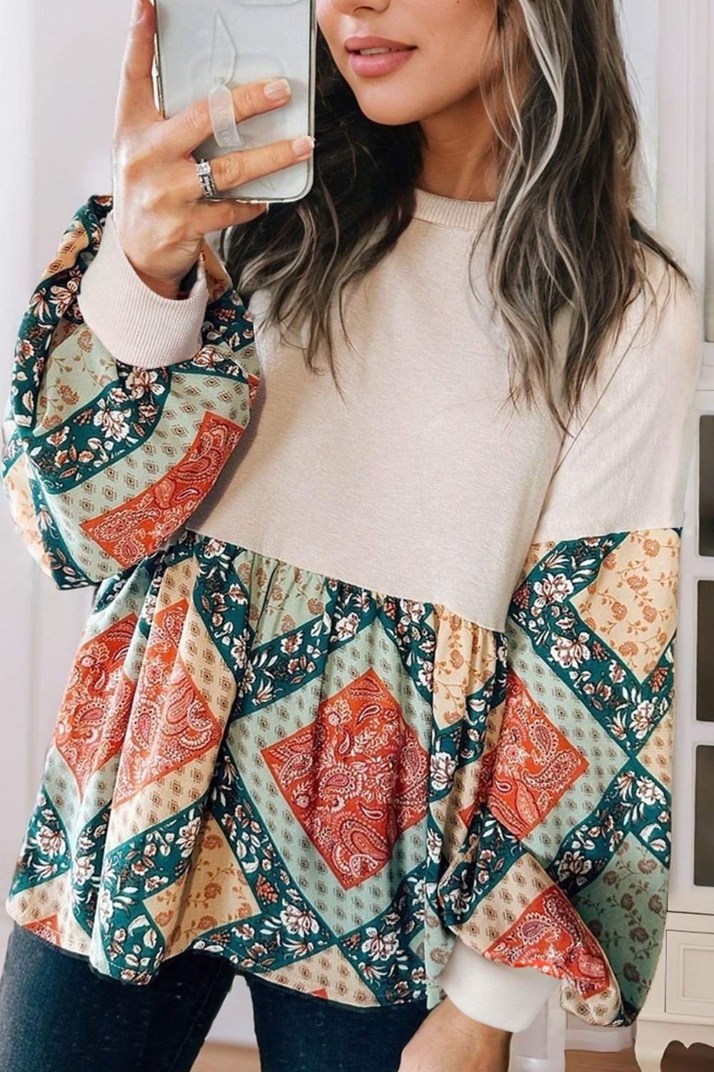 Beige peplum knit tunic with patchwork paisley print sleeves and hem