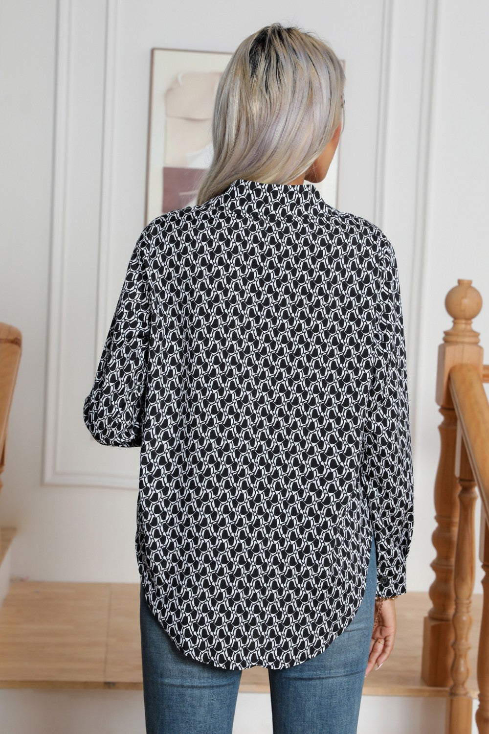 Black and white monogram print collared blouse with buttoned cuffs.