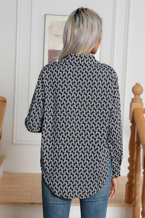 Black and white monogram print collared blouse with buttoned cuffs.